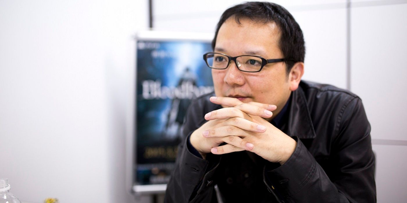 Hidetaka-Miyazaki hands in front of his face