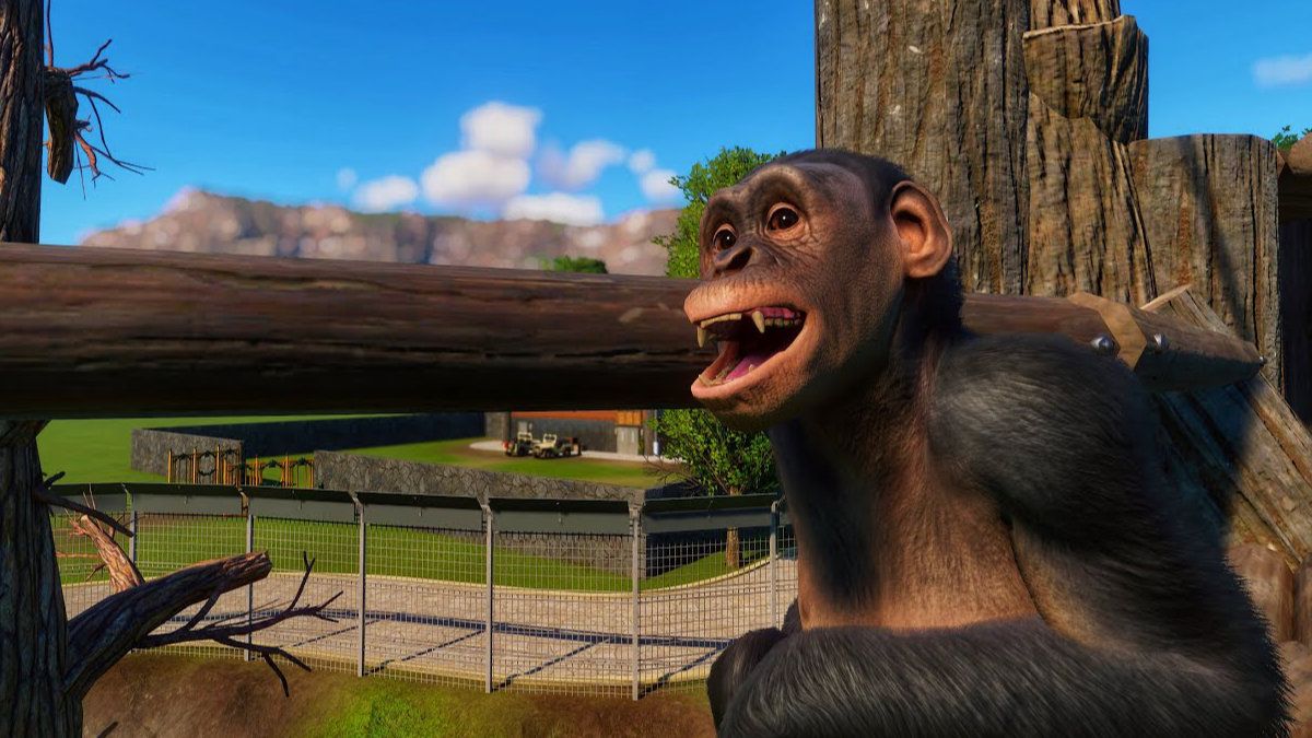 A bonobo sat by a log in its habitat.