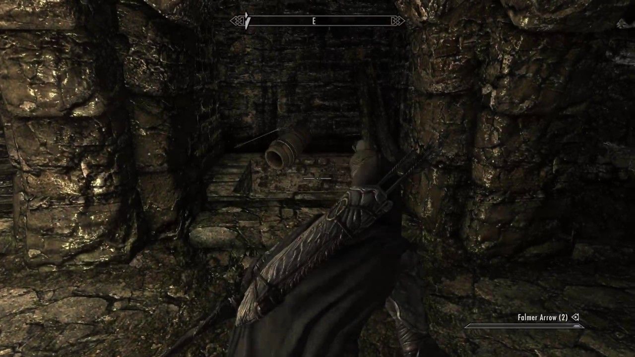 Skyrim player wielding Dravin's Bow in a dungeon