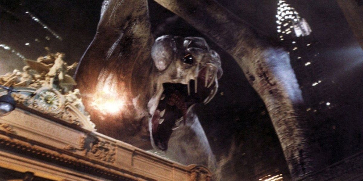 A close shot of the Cloverfield monster opening its mouth and being shot.