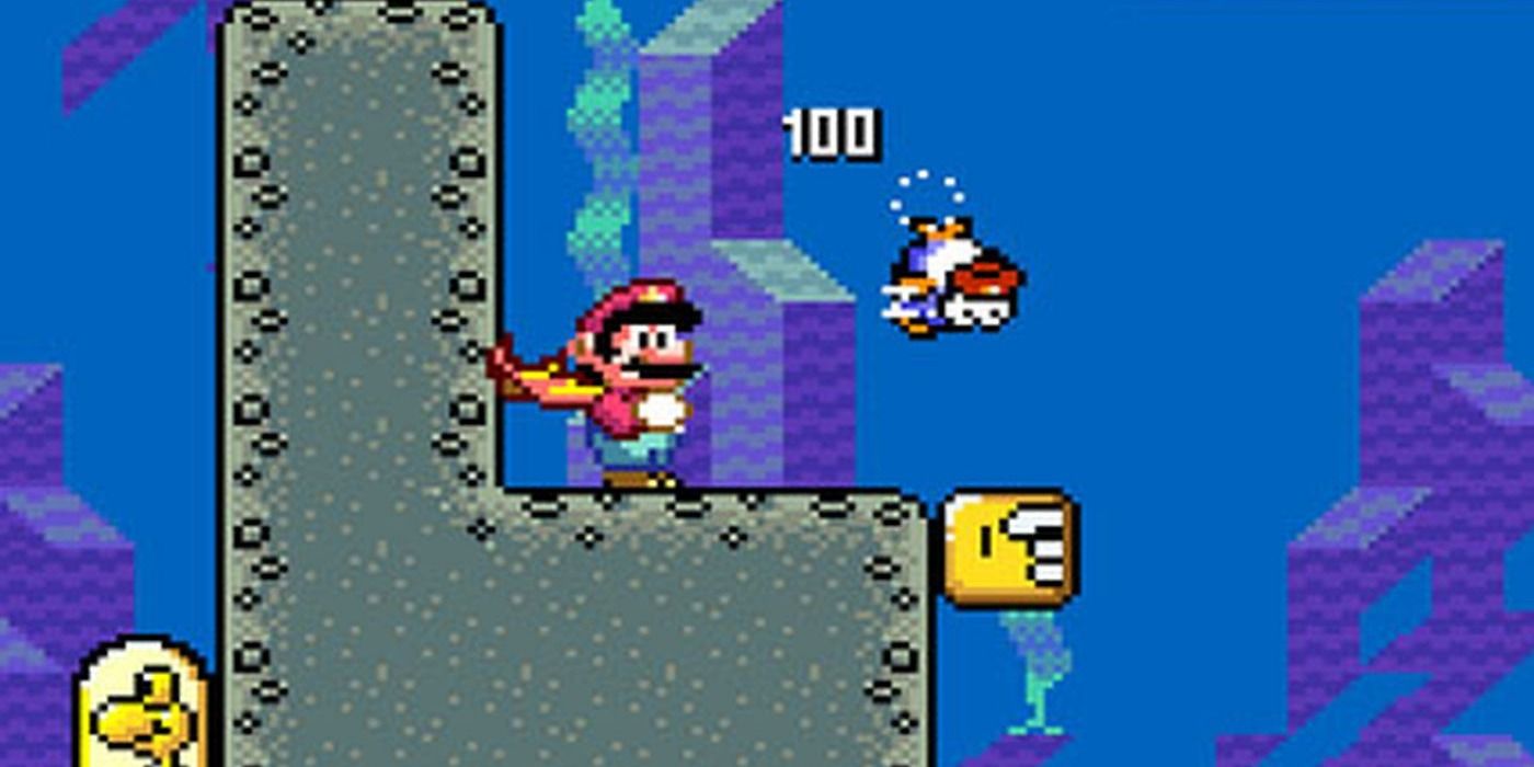 Super Mario World Screenshot Of Mario Underwater With A Cape And A Dead Fish Near Him