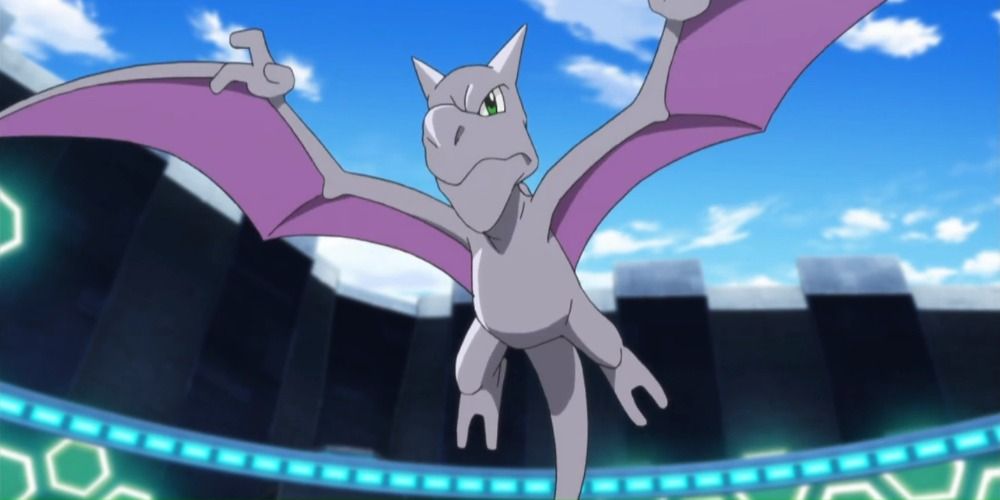 Aerodactyl from the Pokemon anime flying in a stadium