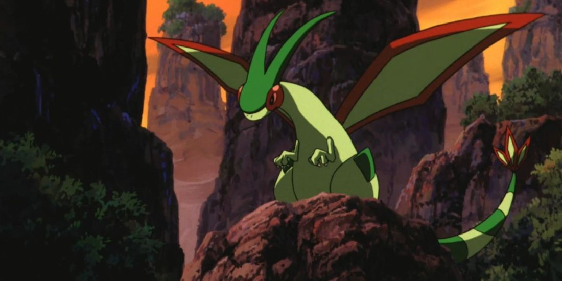 Pokemon Flygon Sitting On A Rock