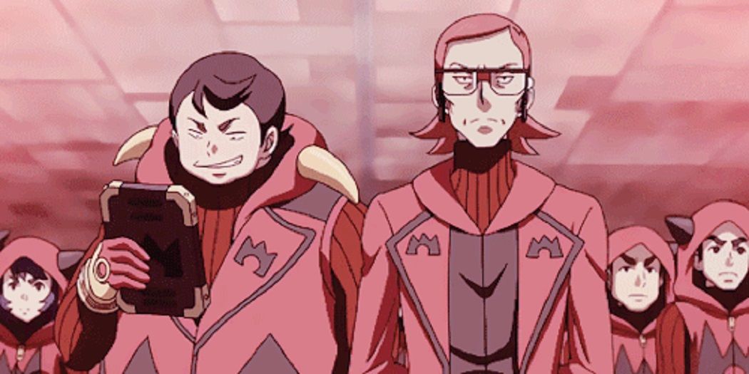 Maxie and an admin standing in front of Team Magma