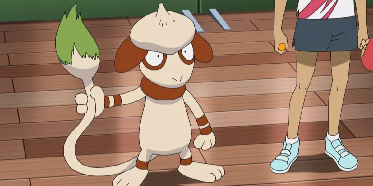 Smeargle next to a trainer in the Pokemon anime holding its tail
