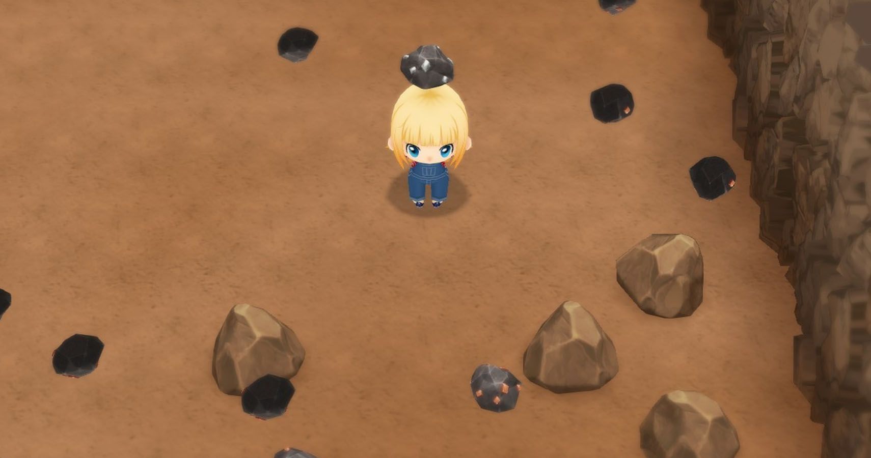 Clare in the mine holding some ore.