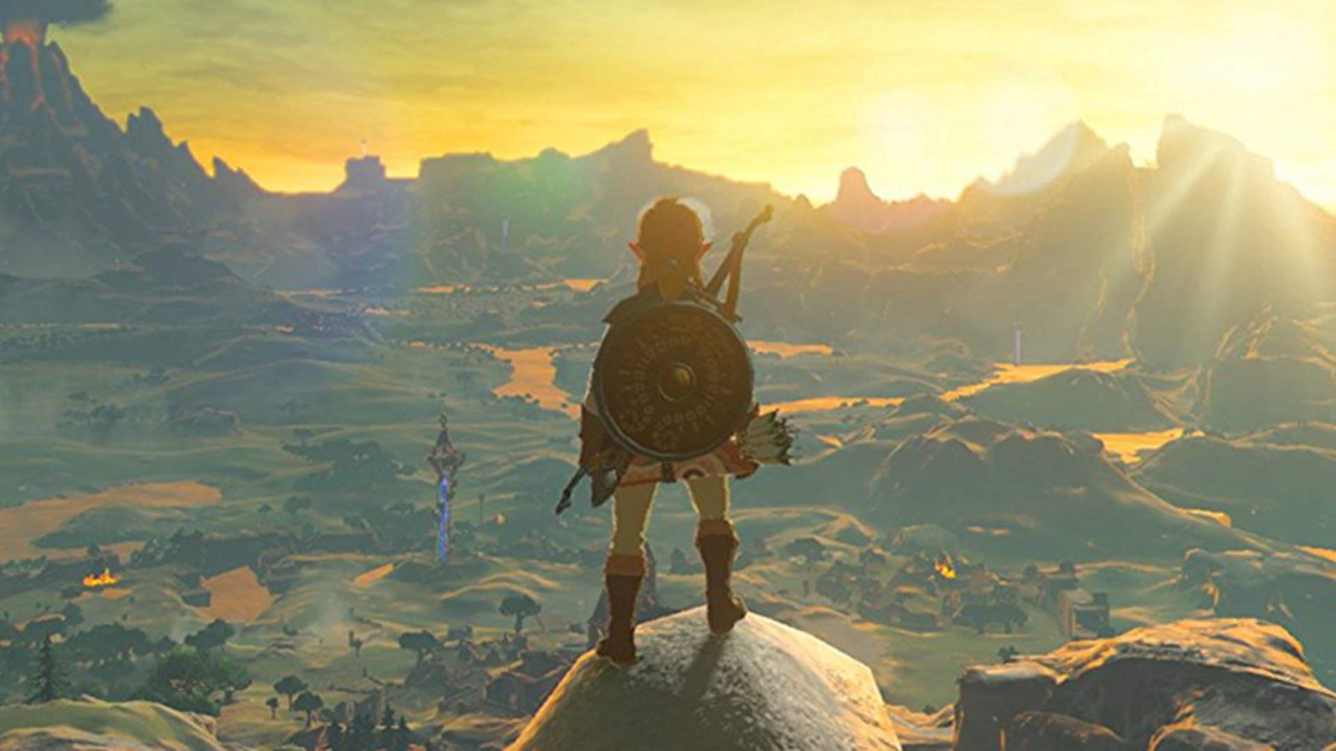 Link stands on the edge of a cliff looking over Hyrule.