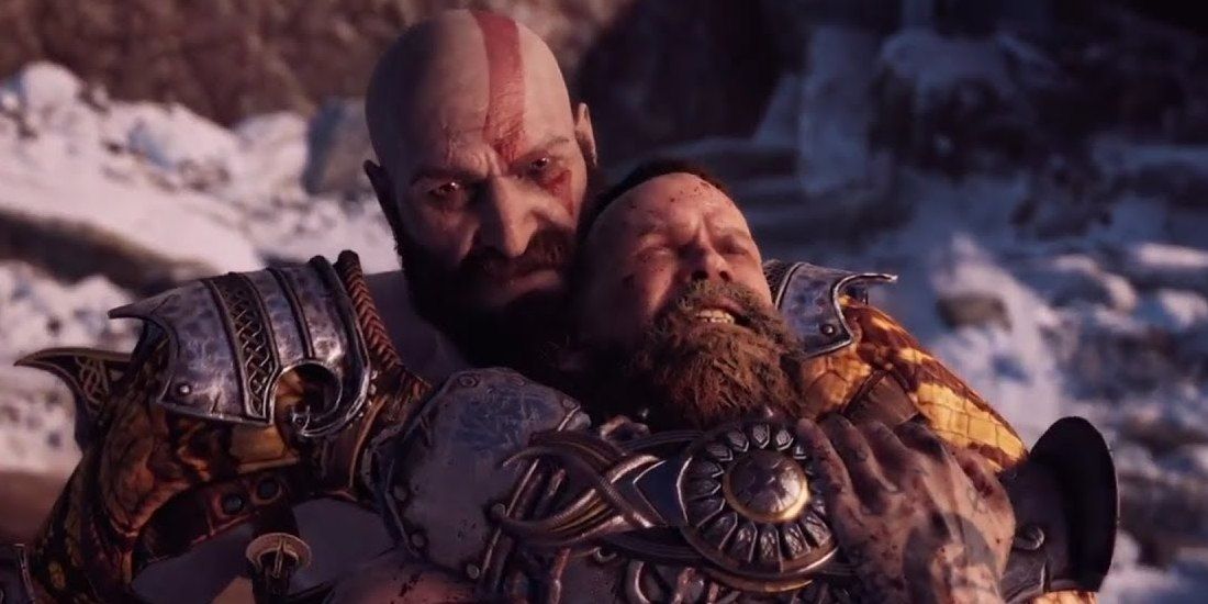 Kratos holding Baldur