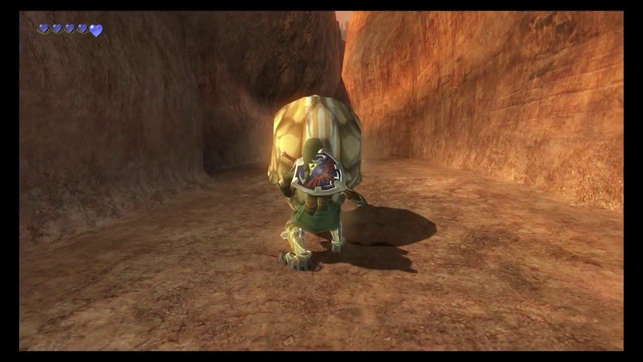 Link uses his Iron Boots to resist the strength of a rolling Goron on Death Mountain in Twilight Princess.
