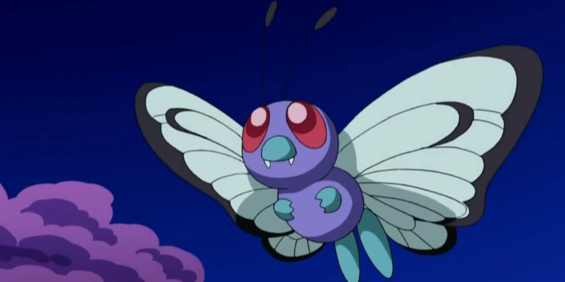 Butterfree flying in the night sky in the Pokémon anime