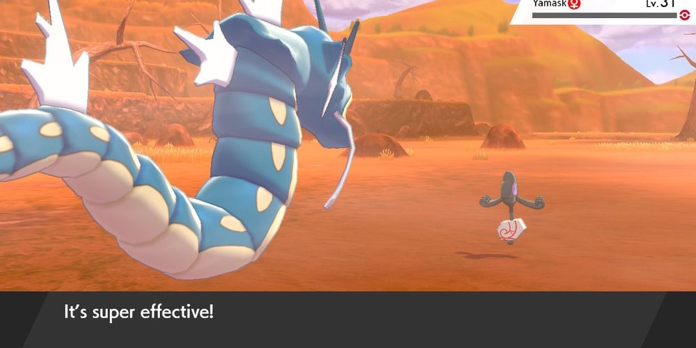 Yamask being dealt a super effective blow from Gyarados
