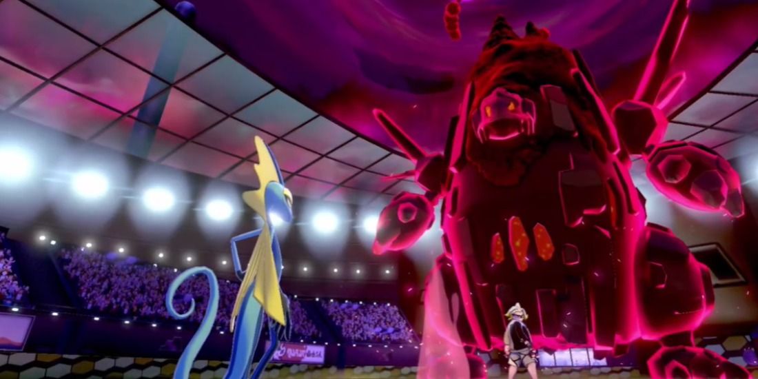 An Inteleon facing down Gordie's Coalossal in Pokémon Sword & Shield