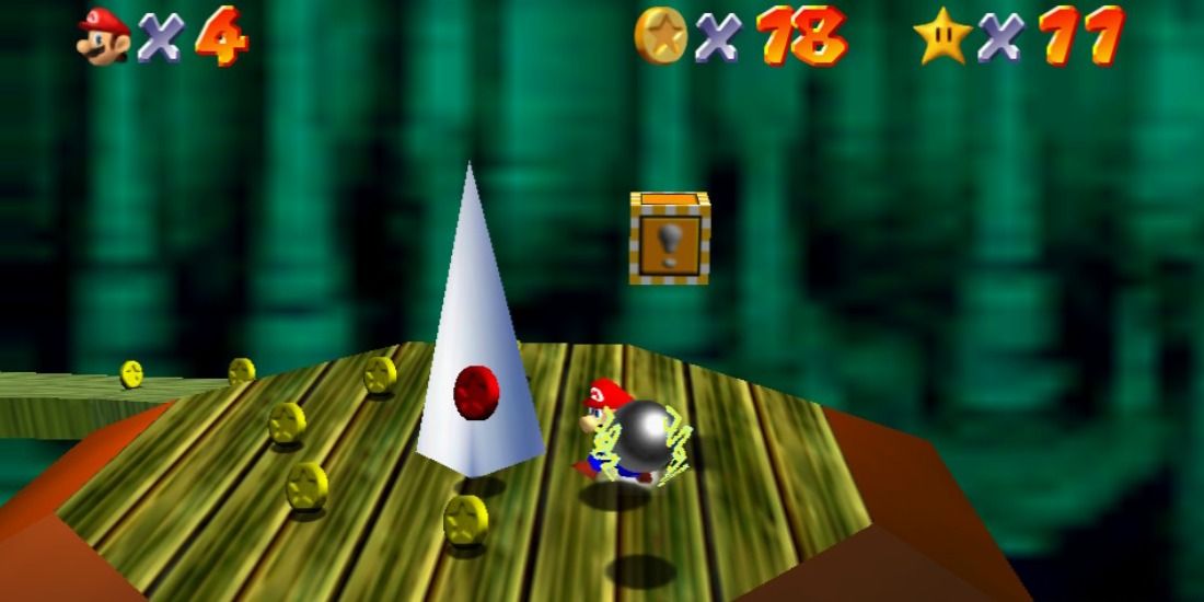 Mario collecting coins and nearly getting hit in Super Mario 64