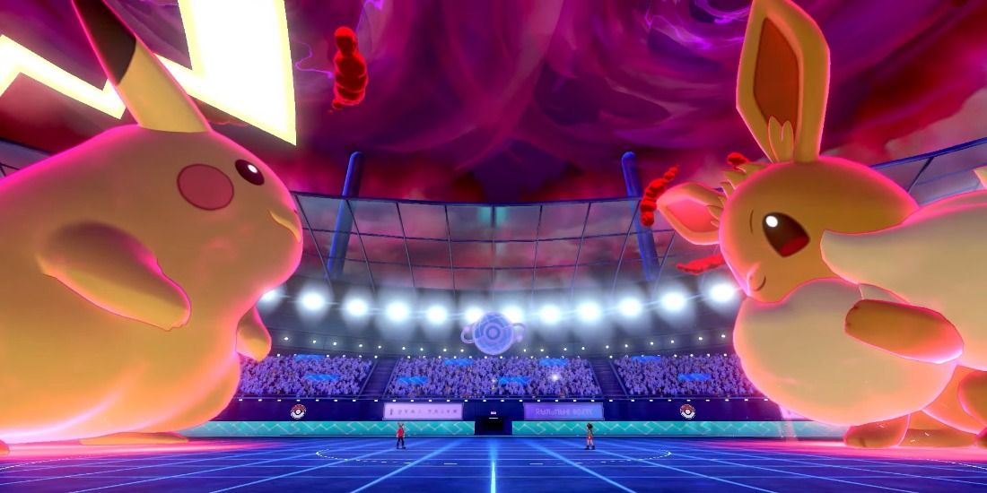Gigantamax Pikachu and Eevee fighting each other in Pokémon Sword & Shield