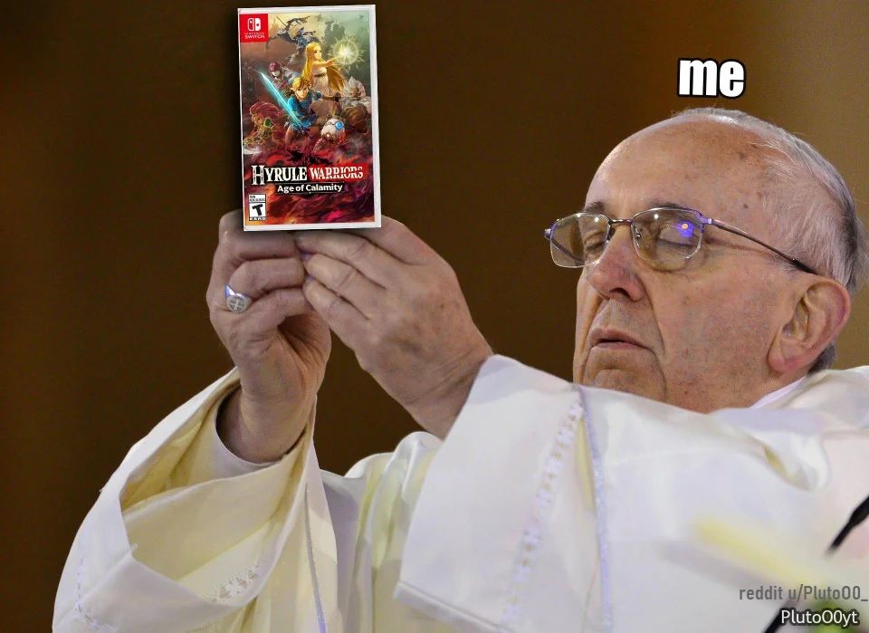 Pope Francis holding a copy of HWAOC