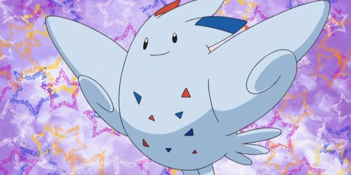 Togekiss with a confetti background