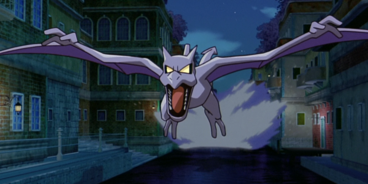Aerodactyl flying down street at night
