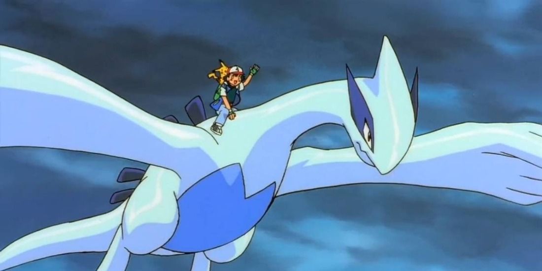 Ash happily riding an angry Lugia in the Pokemon Anime