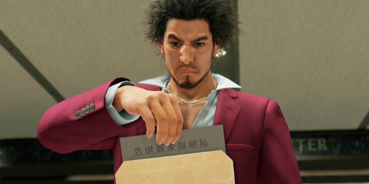Ichiban angrily looking at paper in an envelope