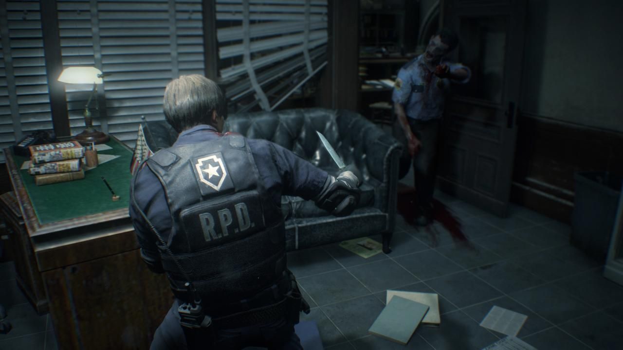 Leon holding knife toward police zombie