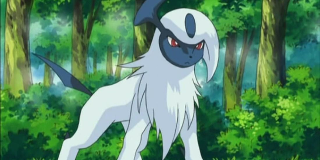Absol standing in a forest in the Pokemon anime