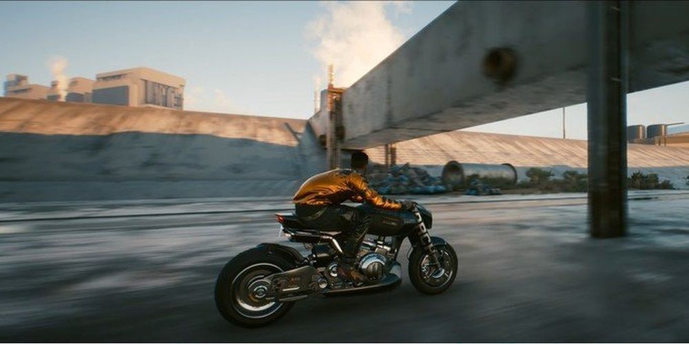 Cyberpunk 2077 V On Motorcycle Driving Through Concrete Valley