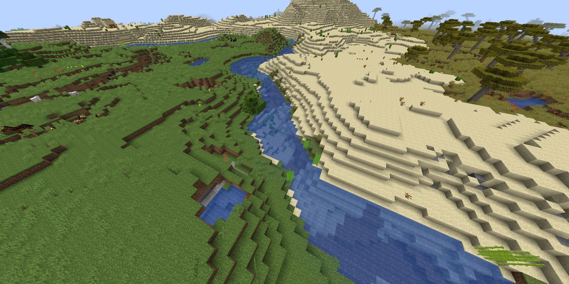 Minecraft river dividing a plains and desert biome.