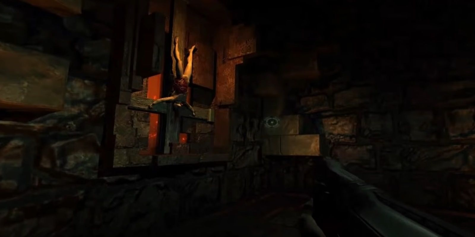 Doom 3: Doom guy is in hell staring at an upside down man cut open