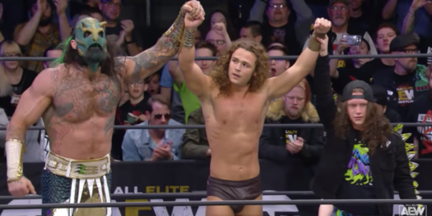 Jurassic Express (from left to right, Luchasaurus, Jungle Boy and Marko Stunt) celebrate Jungle Boy's victory on an episode of AEW Dark