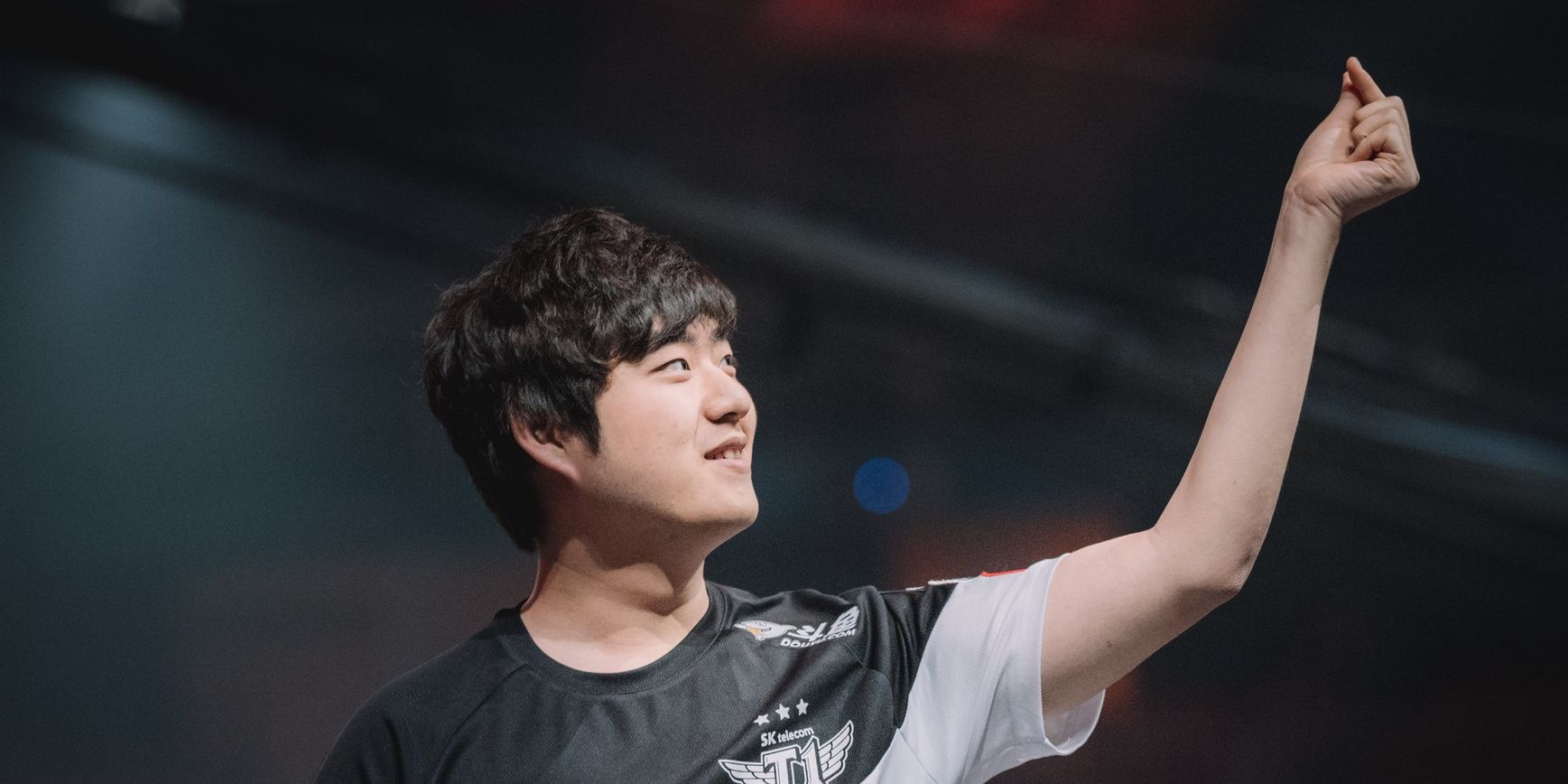 Bang doing his signature finger snap on stage after winning a game