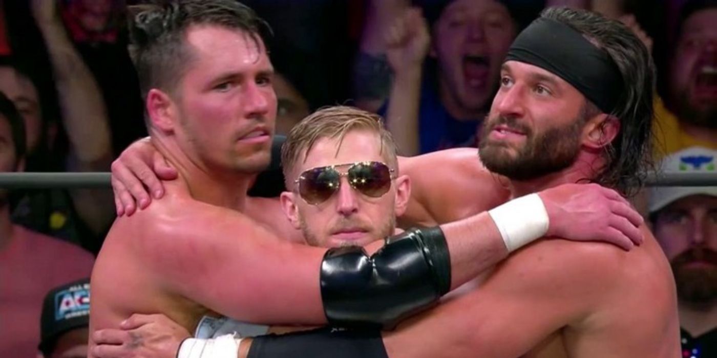 The Best Friends (from left to right: Chuck Taylor, Orange Cassidy and Trent) hug it out after a match