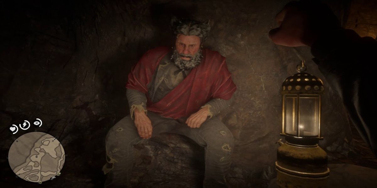 A player stands in front of the Cave Hermit in Red Dead Redemption 2