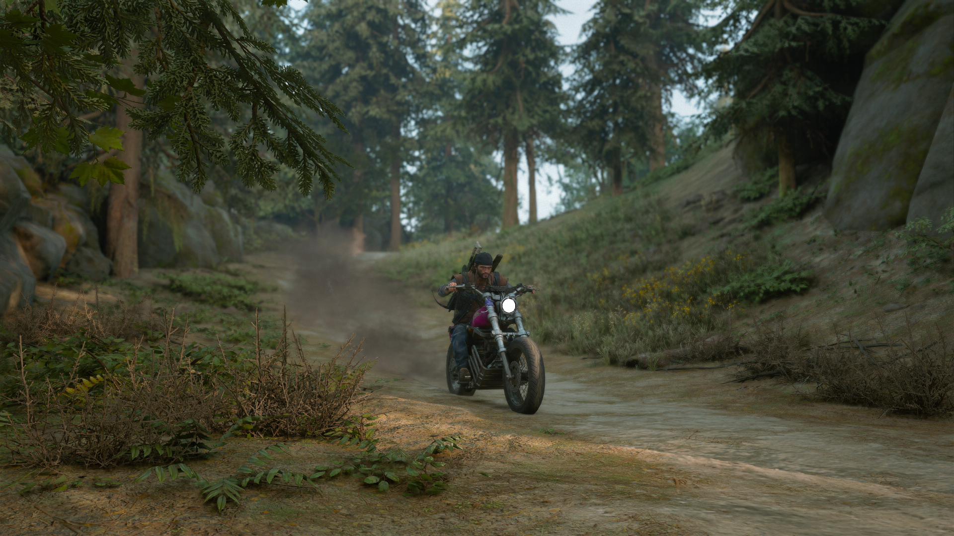 Deacon riding his drifter bike downhill to conserve fuel.