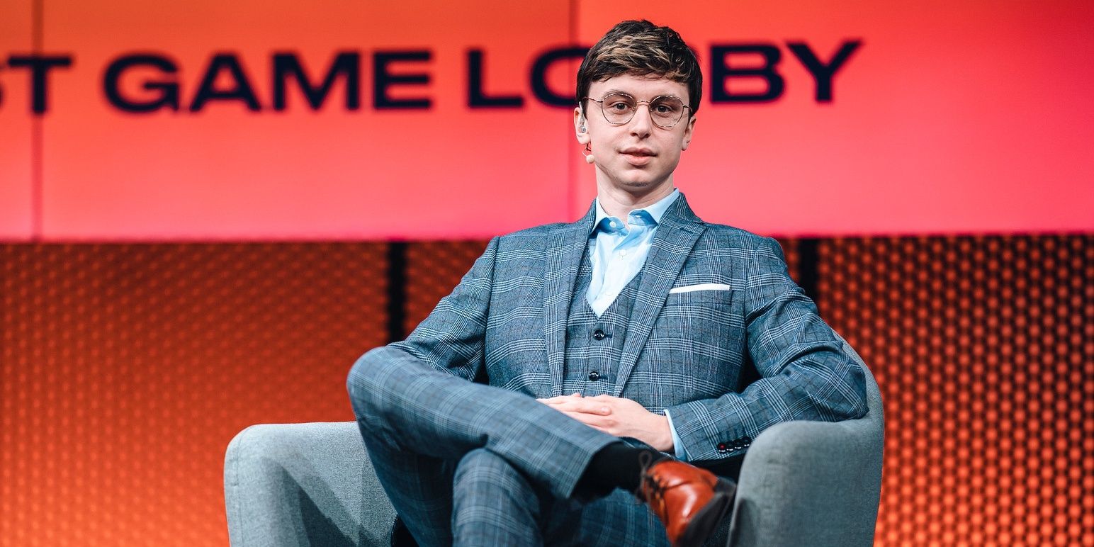 League Of Legends Caedrel In Grey Suit Sitting Looking At Camera