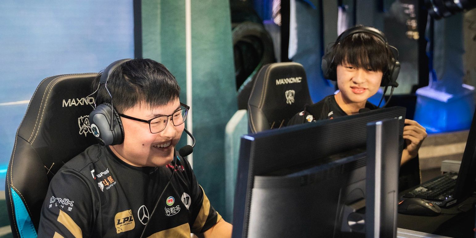 League Of Legends RNG Uzi and Ming Uzi Wearing Headset Looking At Monitor Talking Ming Looking At Uzi