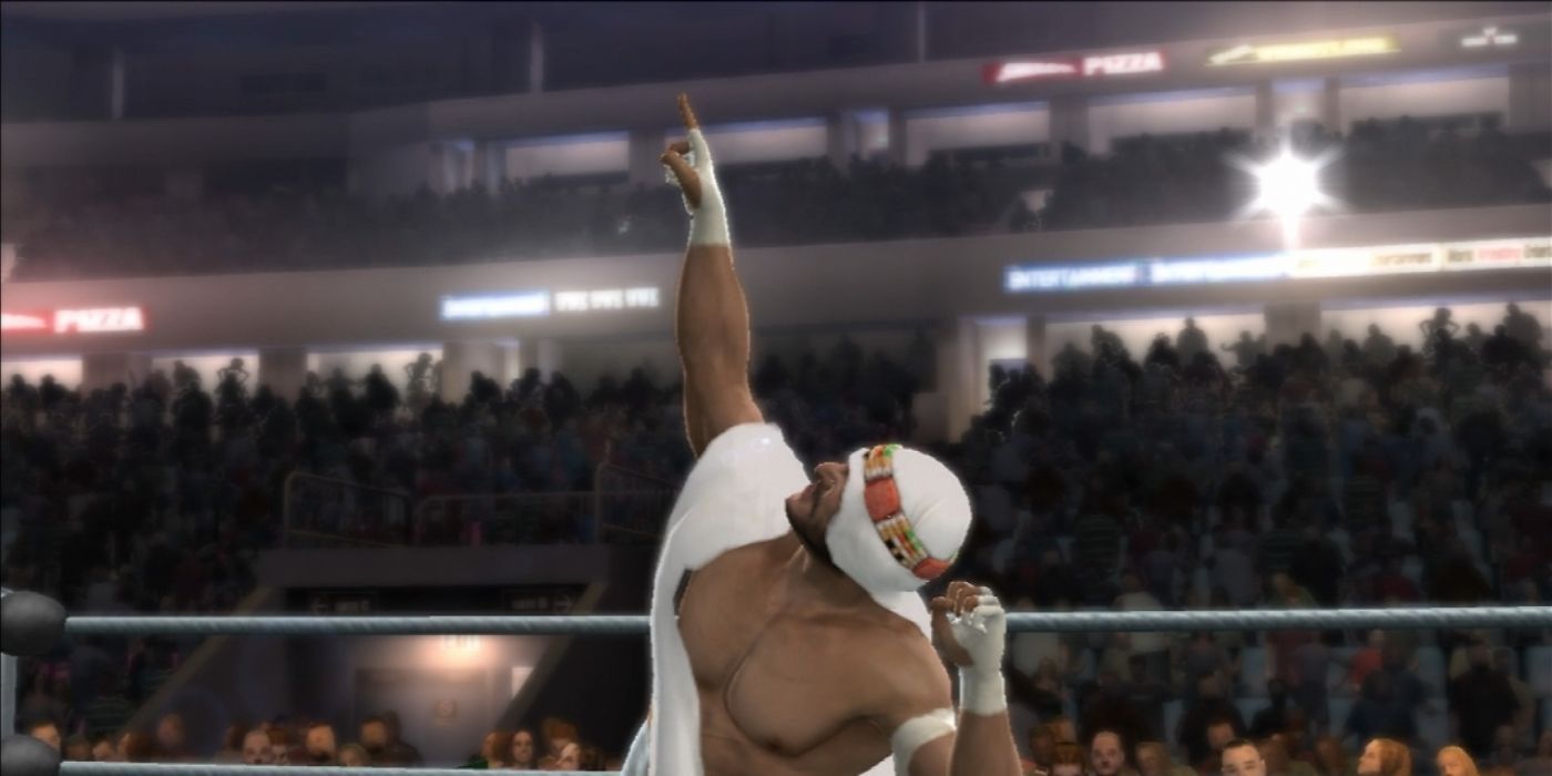 Sabu, with his turban on, points to the sky in the rind during his entrance in SD vs. Raw 2008