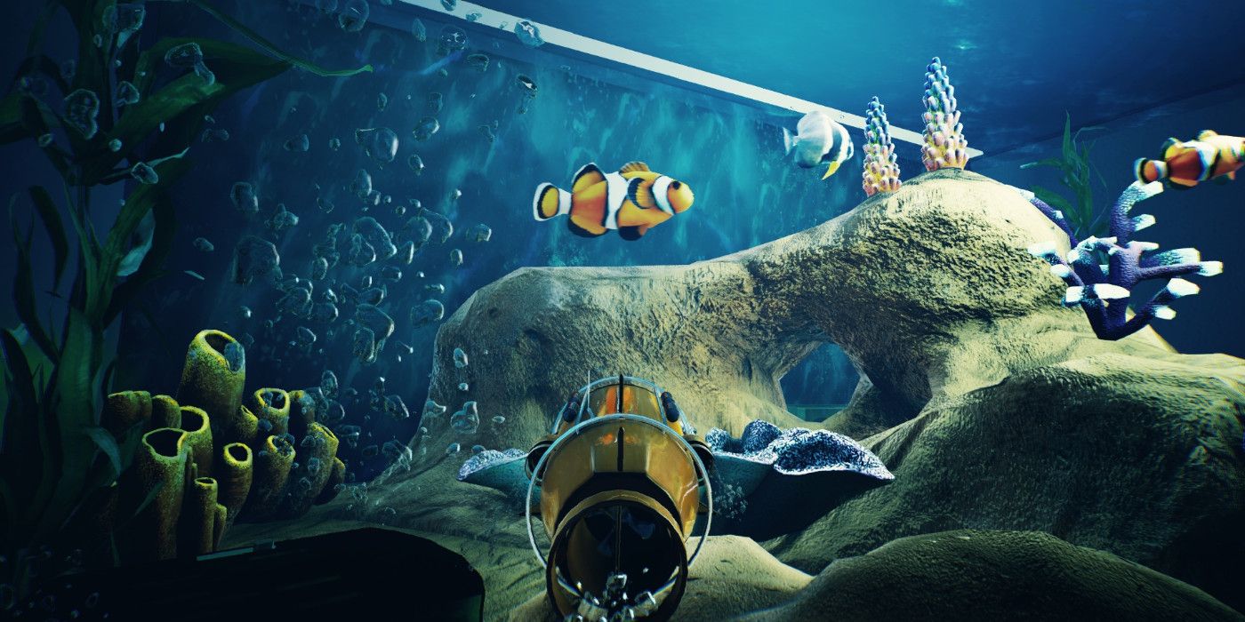 a minature bathysphere in an aquarium with clownfish and coral