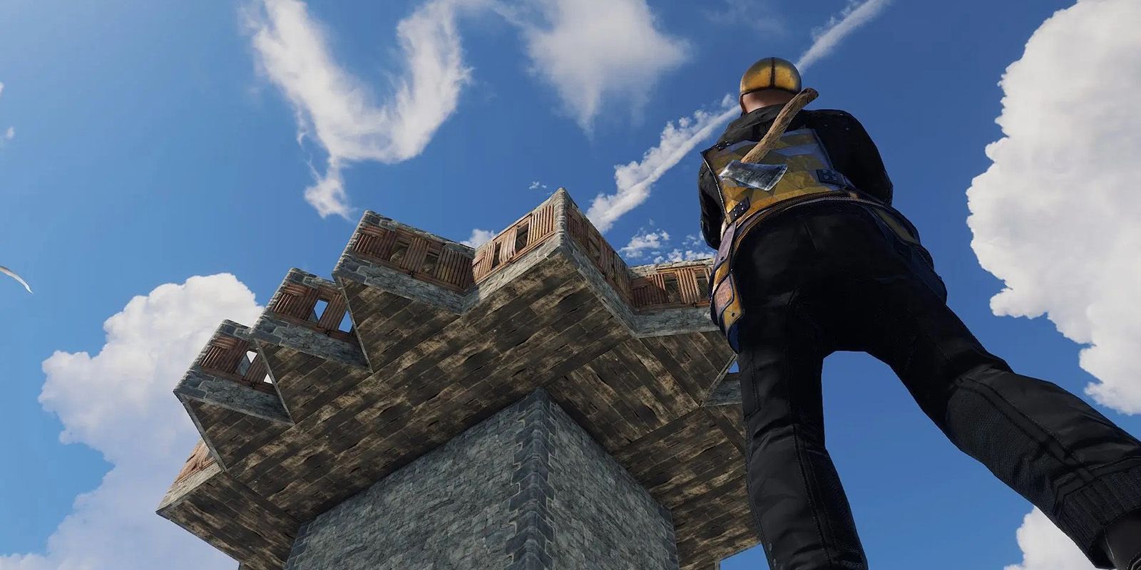 A man stood beside a tower in Rust.