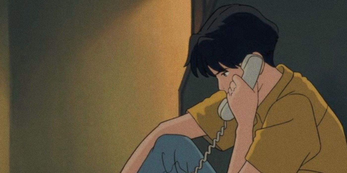 taku sat on the phone in his hallway