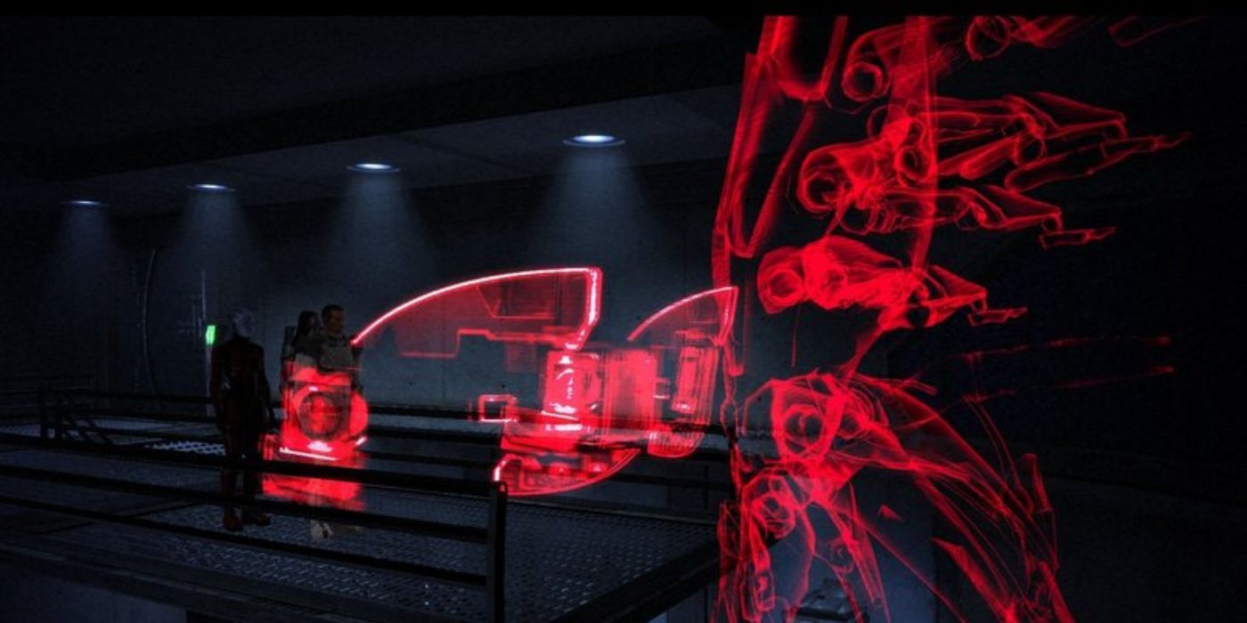 A projection of Sovereign (right) talks to Shepard and their companions on Virmire