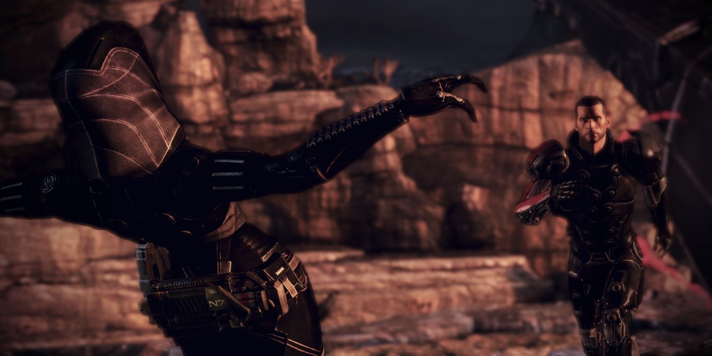 Tali (left) proceeds to kill herself by falling backwards off a cliff as Shepard (right) tries to stop her