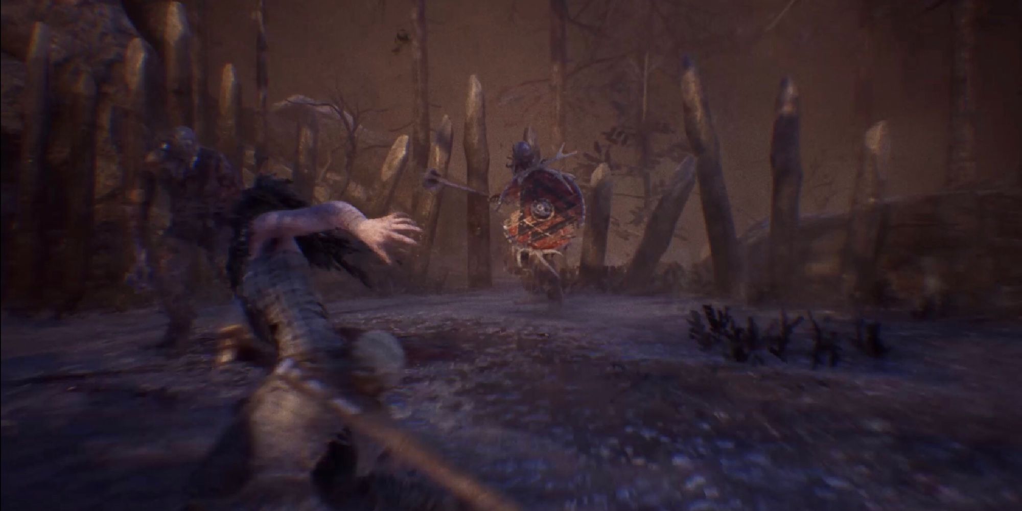 Senua Performs An Evasive Maneuver Against Two Enemies In Hellblade: Senua’s Sacrifice
