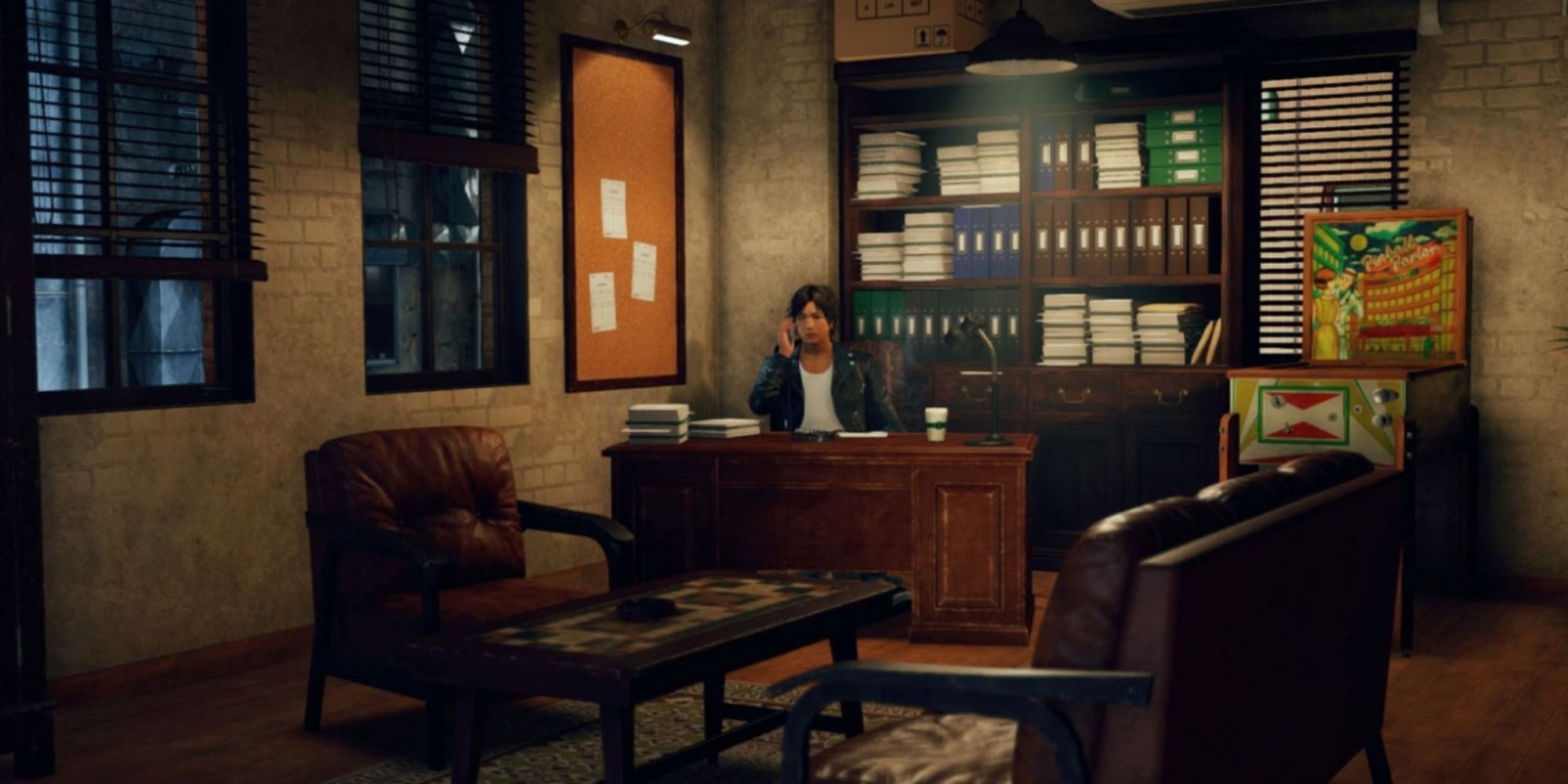 Judgment: Yagami sitting at his desk at his detective agency
