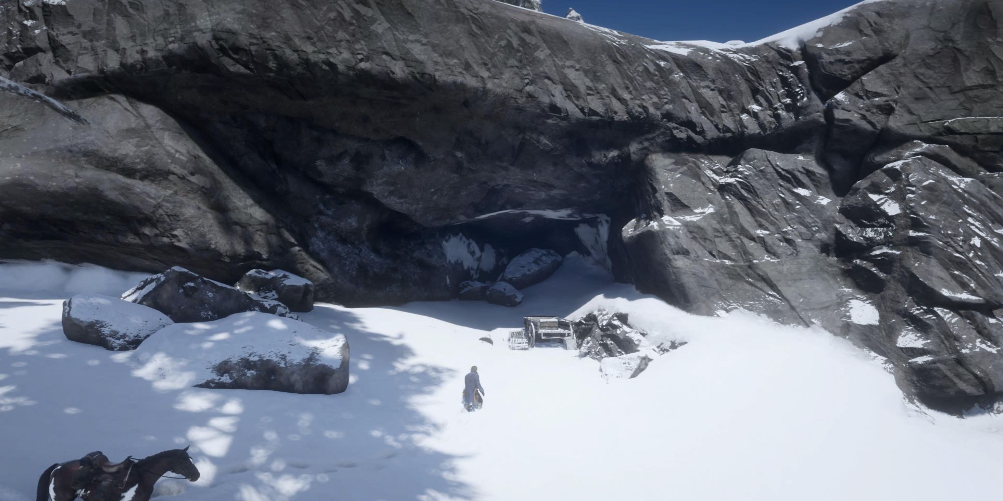 Red Dead Redemption 2 Cave in mountain side with horse and Arthur