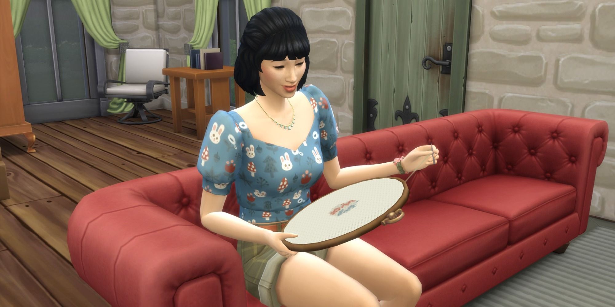 Sims 4 A Sim Cross Stitching while sat on a sofa