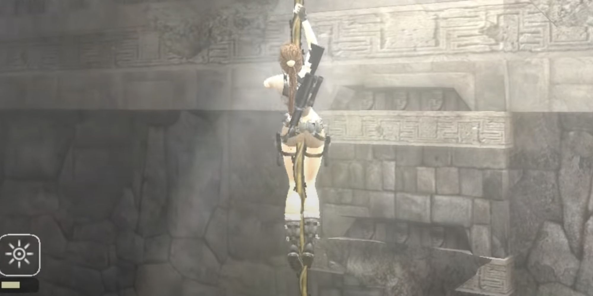 Lara hanging from the rope on her way to claim the gold reward in Peru in Tomb Raider Legend.