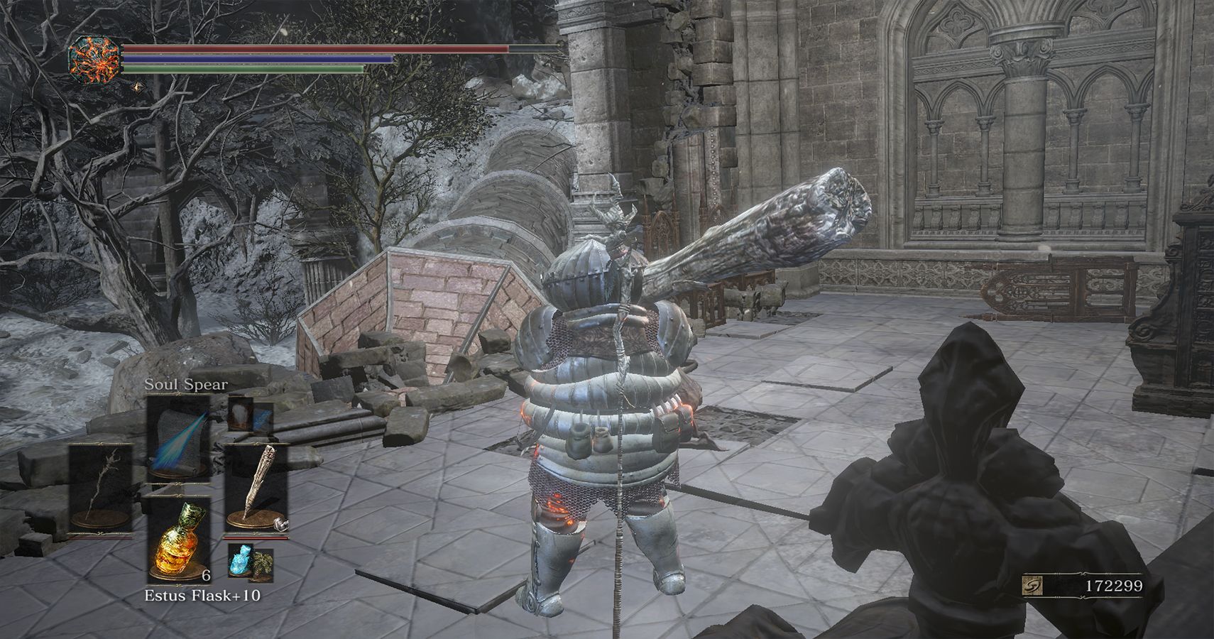 player standing in ruins with collapsed tower ahead