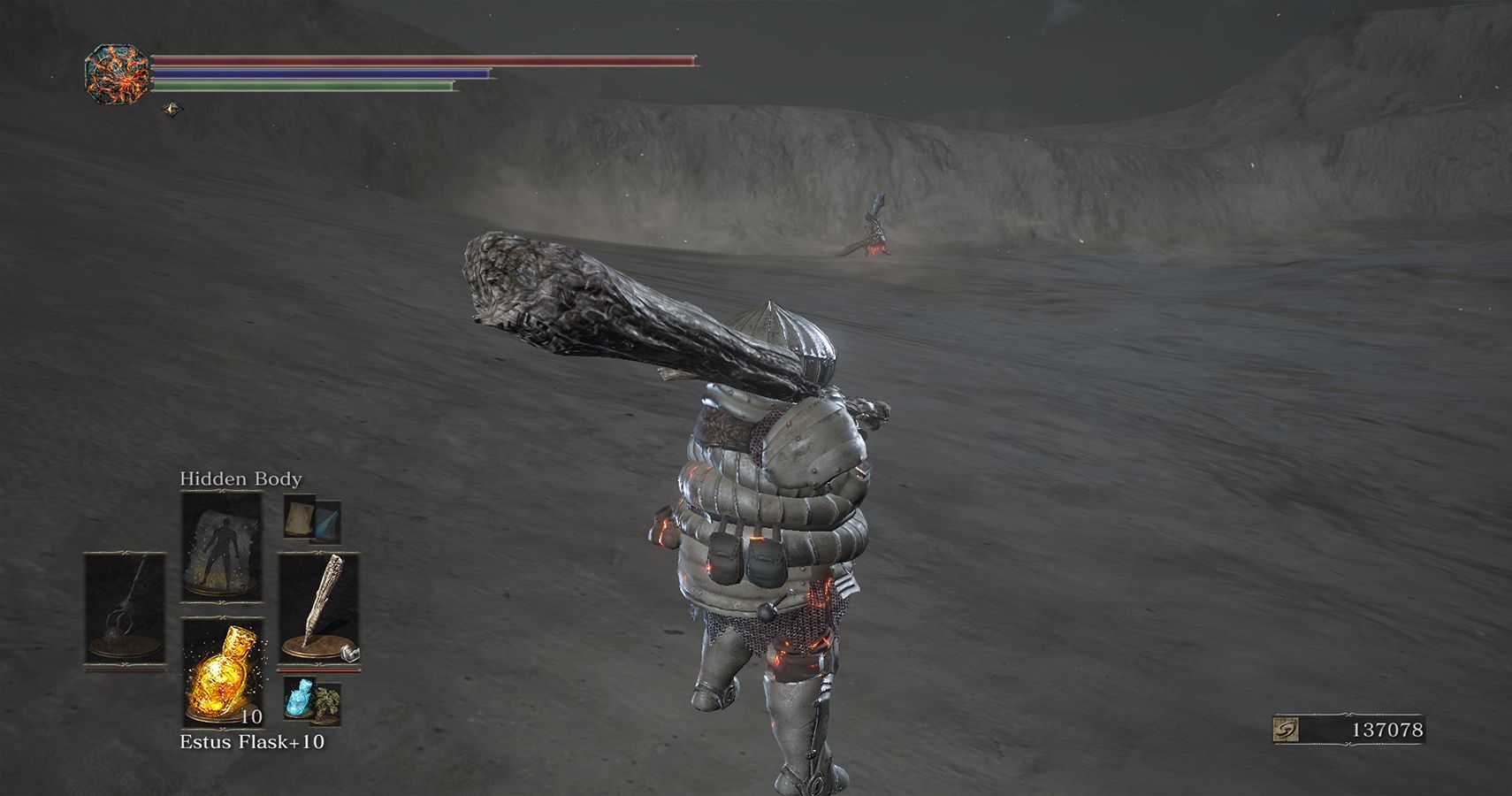 player standing in desert of ash with a bonfire nearby