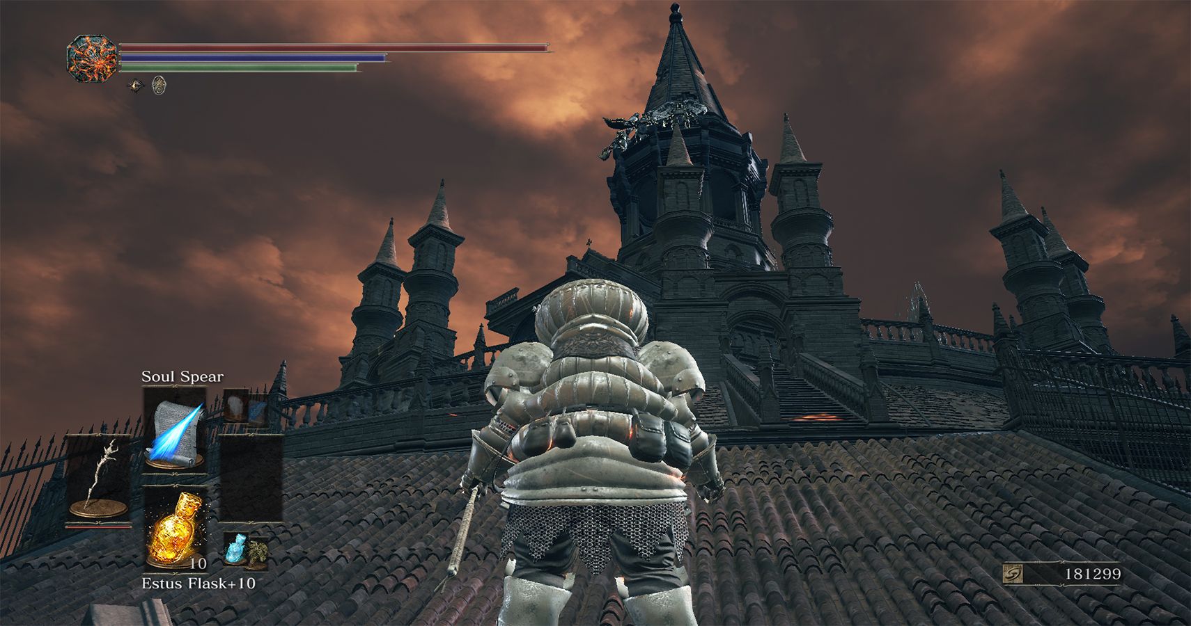 player looking up at castle structure with orange skies
