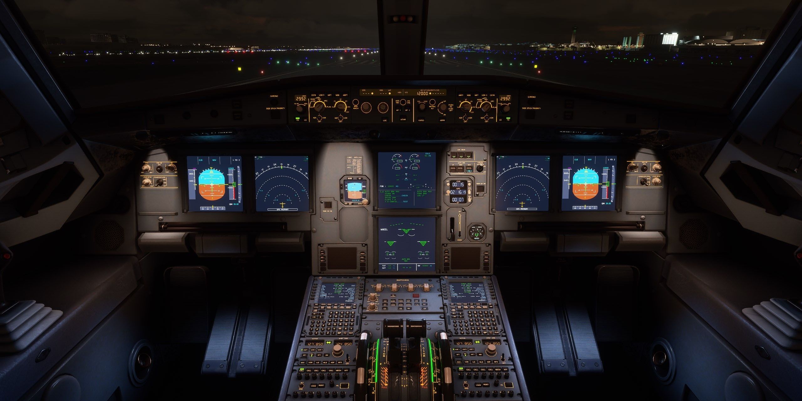 The cockpit of the Airbus A320neo with lite up controls at night in Microsoft Flight Simulator